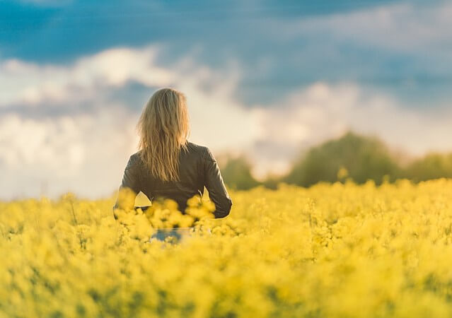 Woman in the field. Image courtesy of pexels.com